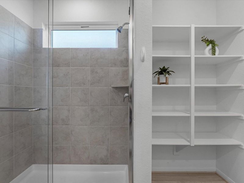 Large shower and open cabinets for accesories and linens