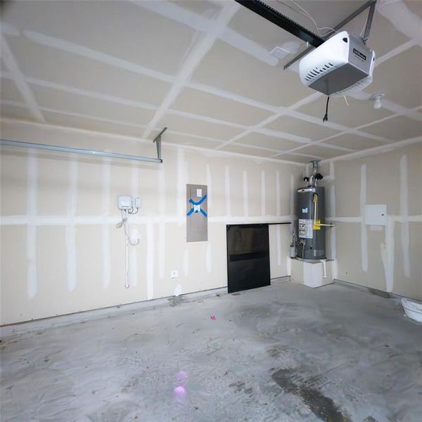 Garage with a garage door opener and water heater