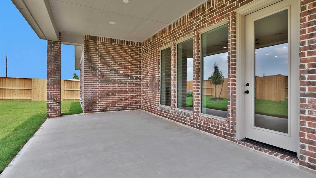 Exterior details and patio area of a home in Meridiana, Manvel (Image 2).