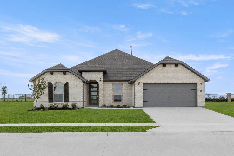Front exterior of a new home in Timberbrook, Justin, TX, highlighting curb appeal (Image 1). Front exterior of a new home in Timberbrook, Justin, TX, highlighting curb appeal (Image 1).