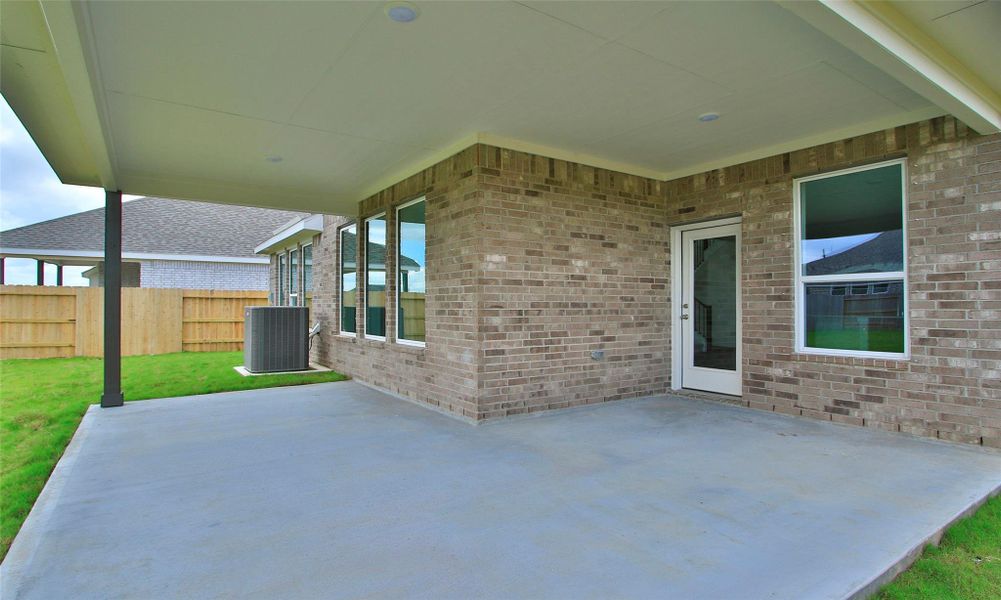 Exterior details and patio area of a home in Creekhaven, Iowa Colony (Image 2). Exterior details and patio area of a home in Creekhaven, Iowa Colony (Image 2).