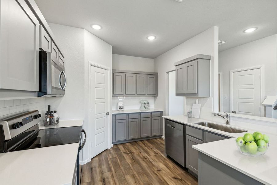Kitchen in the Sapphire home plan by Trophy Signature Homes – REPRESENTATIVE PHOTO Kitchen in the Sapphire home plan by Trophy Signature Homes – REPRESENTATIVE PHOTO