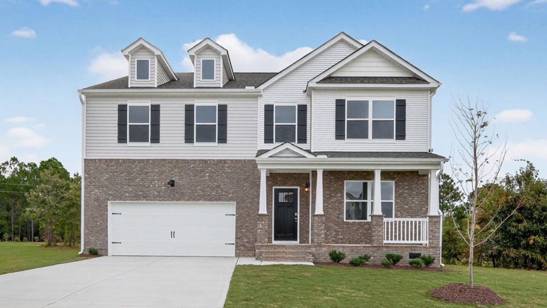 Representative exterior photo of a completed home built from the COLUMBIA by D.R. Horton in Mason Ridge, Spring Lake, NC (Image 24).