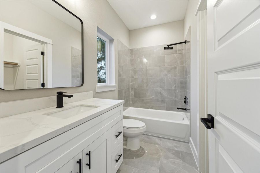 En-suite secondary bathroom *picture is of a previously constructed home by the builder. 812 Thornton finishes will be very similar but this photo is meant to show craftsmanship, quality and to show a product very similar to the plan for 812 Thornton. However, the builder has the right to change finishes at their sole discretion. En-suite secondary bathroom *picture is of a previously constructed home by the builder. 812 Thornton finishes will be very similar but this photo is meant to show craftsmanship, quality and to show a product very similar to the plan for 812 Thornton. However, the builder has the right to change finishes at their sole discretion.