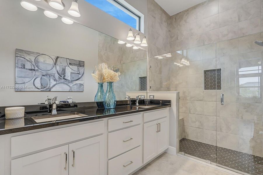 Double Vanity and Upgraded Tile to the Ceiling