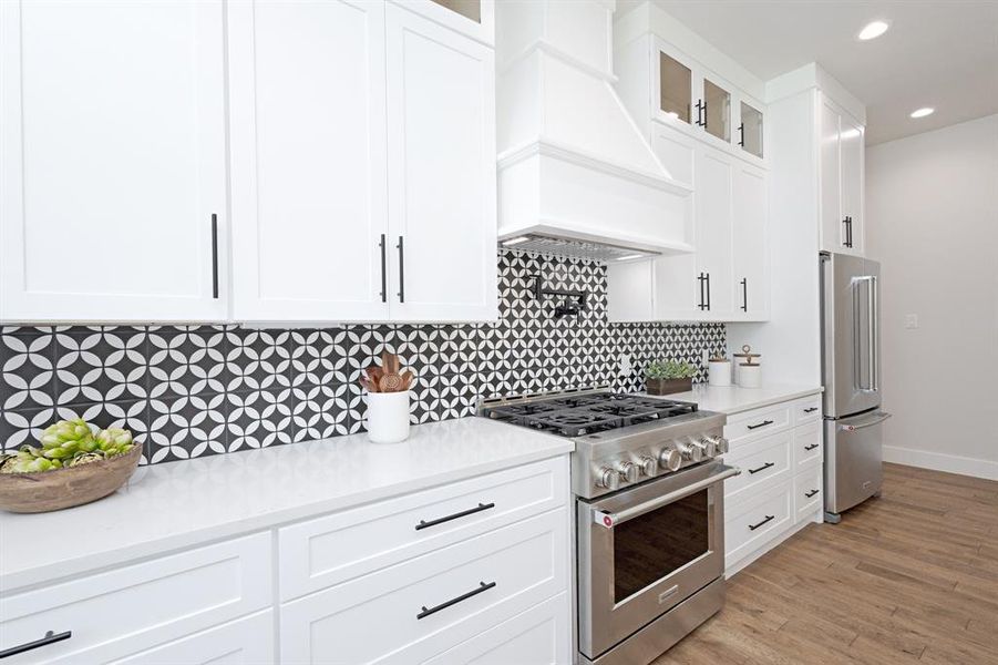 A true Chef’s Kitchen with Premium Appliances, a Pot Filler, and Designer Finishes. A true Chef’s Kitchen with Premium Appliances, a Pot Filler, and Designer Finishes.