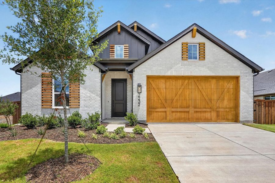 Front exterior of a new home in Sonoma Verde, McLendon-Chisholm, TX, highlighting curb appeal (Image 1). Front exterior of a new home in Sonoma Verde, McLendon-Chisholm, TX, highlighting curb appeal (Image 1).