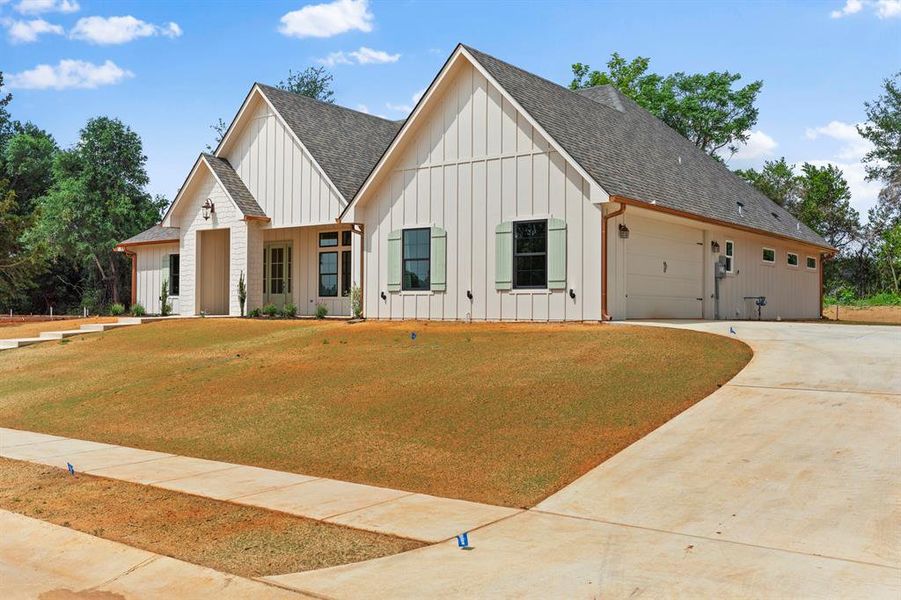 Front exterior of a new home in , Lindale, TX, highlighting curb appeal (Image 27).
