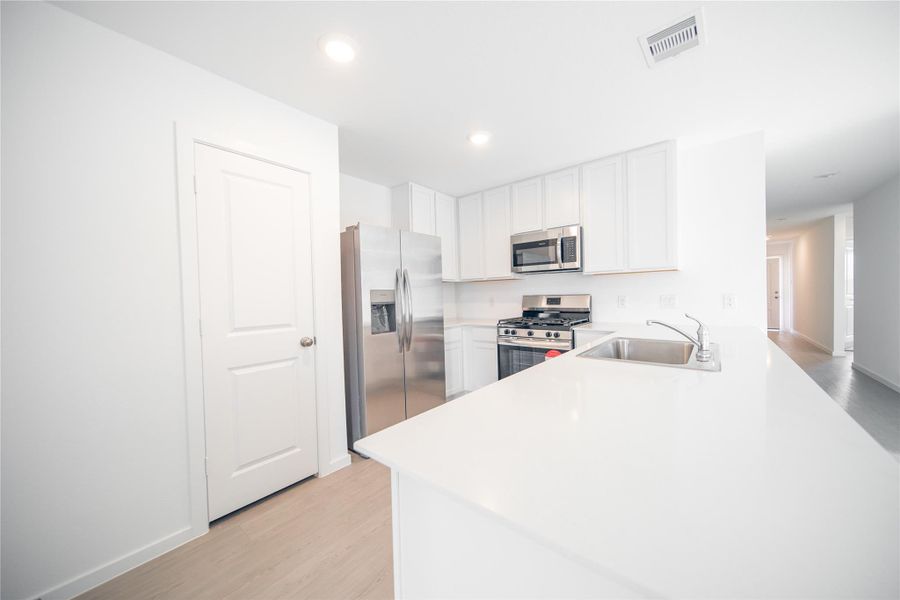 Furnished interior view inside a new home in Anniston: Watermill Collection, Katy (Image 3).