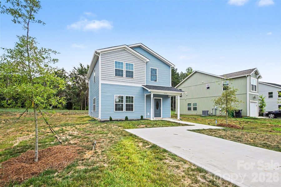 Front exterior of a new home in , Charlotte, NC, highlighting curb appeal (Image 15).