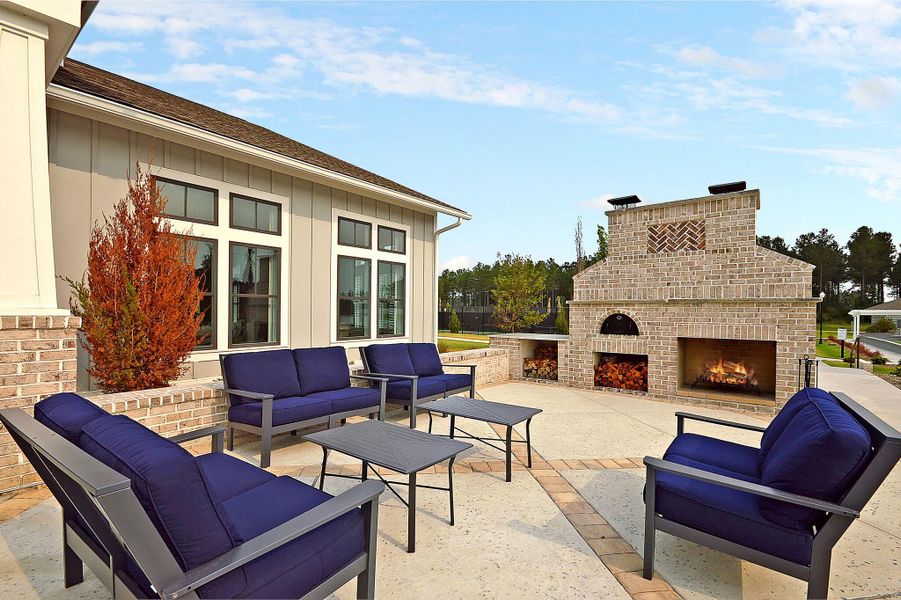 Exterior details and patio area of a home in K. Hovnanian's® Four Seasons at Lakes of Cane Bay, Summerville (Image 26).