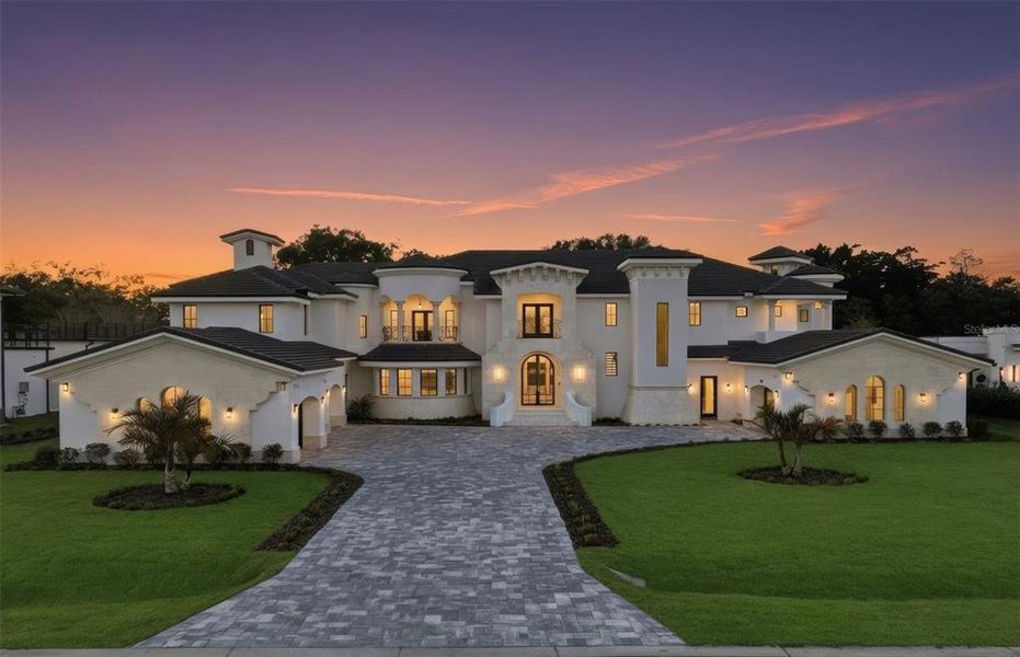 Front exterior of a new home in , Windermere, FL, highlighting curb appeal (Image 25). Front exterior of a new home in , Windermere, FL, highlighting curb appeal (Image 25).