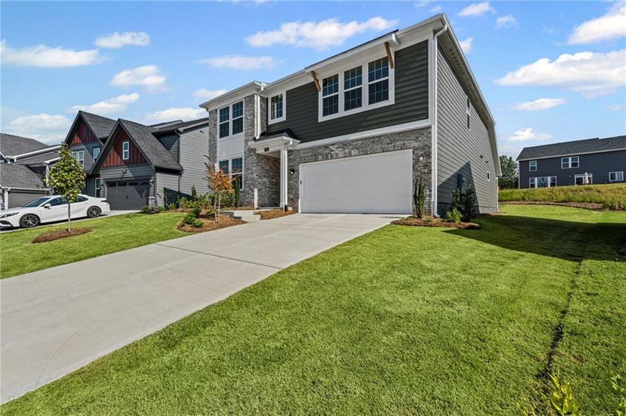 Front exterior of a new home in The Reserve At Liberty Park, Braselton, GA, highlighting curb appeal (Image 23). Front exterior of a new home in The Reserve At Liberty Park, Braselton, GA, highlighting curb appeal (Image 23).