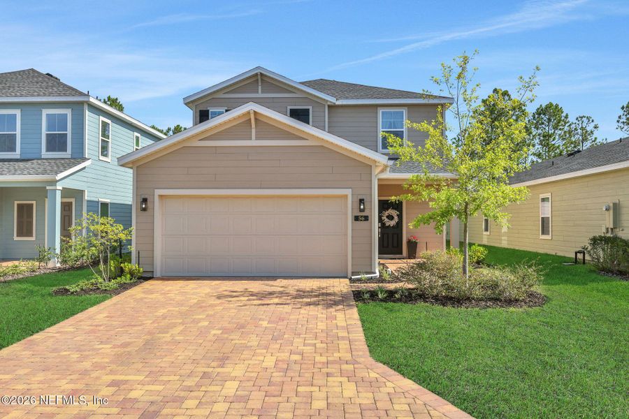 Front exterior of a new home in St Augustine Lakes, St. Augustine, FL, highlighting curb appeal (Image 1). Front exterior of a new home in St Augustine Lakes, St. Augustine, FL, highlighting curb appeal (Image 1).