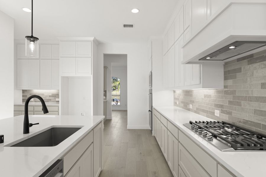 Representative furnished interior of a home built from the Hadley by Windsor Homes in Winding Creek, Rockwall (Image 11).