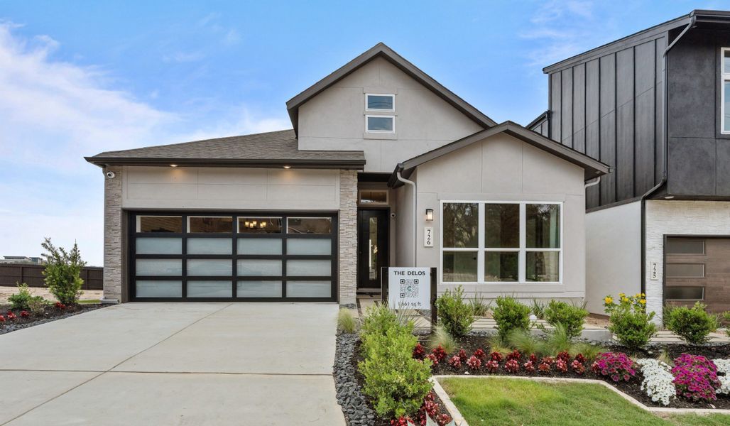 Front exterior of a new home in Centero at Stone Oak, San Antonio, TX, highlighting curb appeal (Image 18).