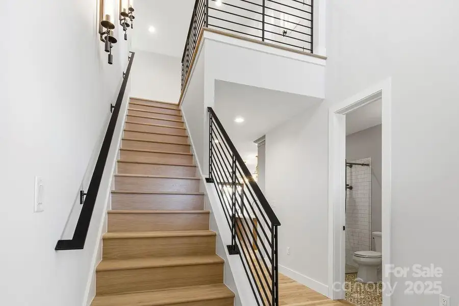 Bright and airy foyer with high ceilings and custom finishes