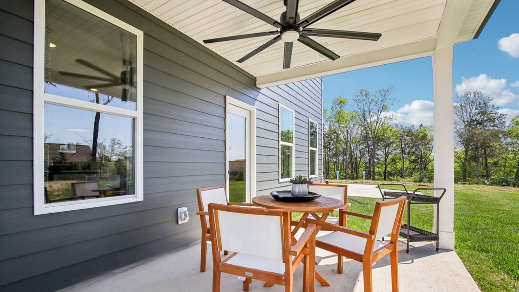 Outdoor living at its finest with covered seating are with fan
