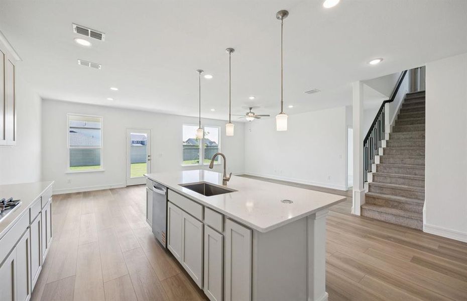 Spacious kitchen with pendant lighting