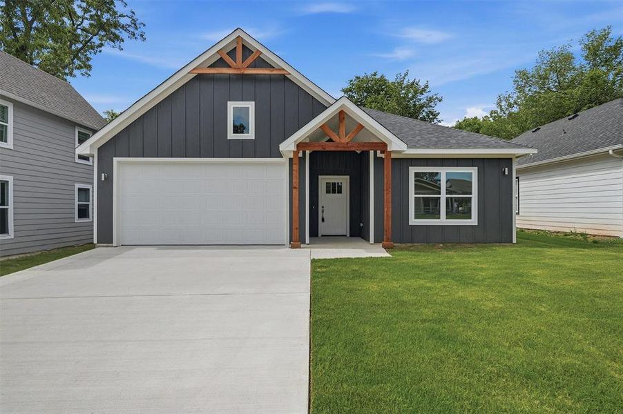 Front exterior of a new home in , Denison, TX, highlighting curb appeal (Image 26). Front exterior of a new home in , Denison, TX, highlighting curb appeal (Image 26).