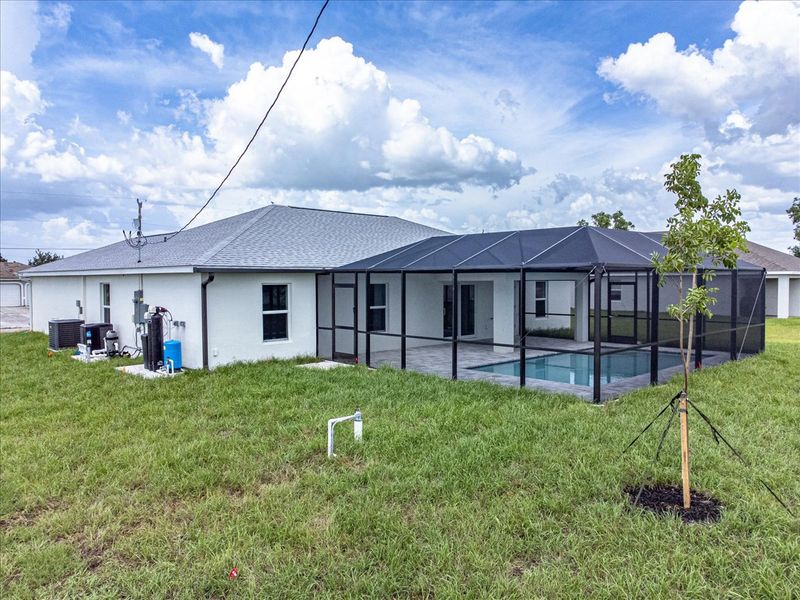 Representative exterior photo of a completed home built from the The Tidewater by Sunlife Homes LLC in Cape Coral, Cape Coral, FL (Image 18). Representative exterior photo of a completed home built from the The Tidewater by Sunlife Homes LLC in Cape Coral, Cape Coral, FL (Image 18).