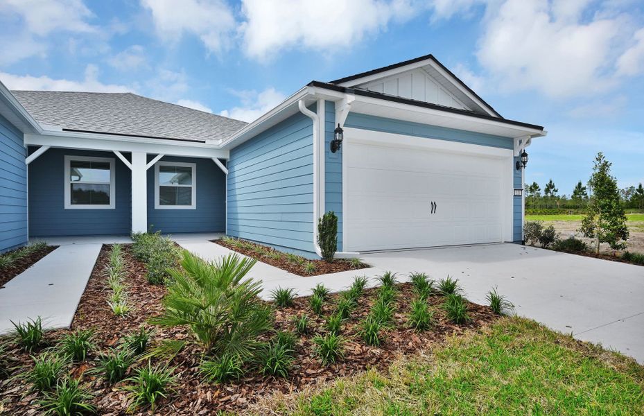 Front exterior of a new home in Del Webb Wildlight, Yulee, FL, highlighting curb appeal (Image 2). Front exterior of a new home in Del Webb Wildlight, Yulee, FL, highlighting curb appeal (Image 2).