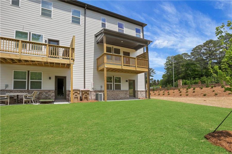 Exterior details and patio area of a home in Towne Village at Suwanee Dam, Sugar Hill (Image 3).