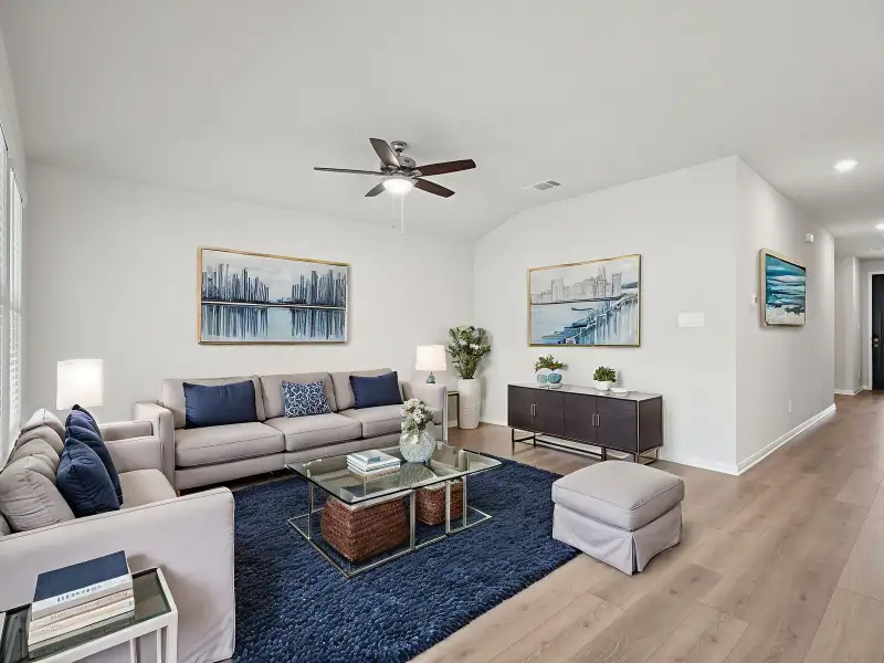 Virtually staged living room in the Briscoe floorplan at a Meritage Homes community. Virtually staged living room in the Briscoe floorplan at a Meritage Homes community.