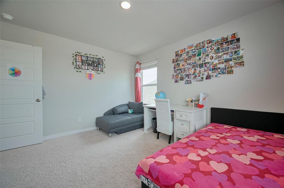 Secondary bedroom with natural lighting.