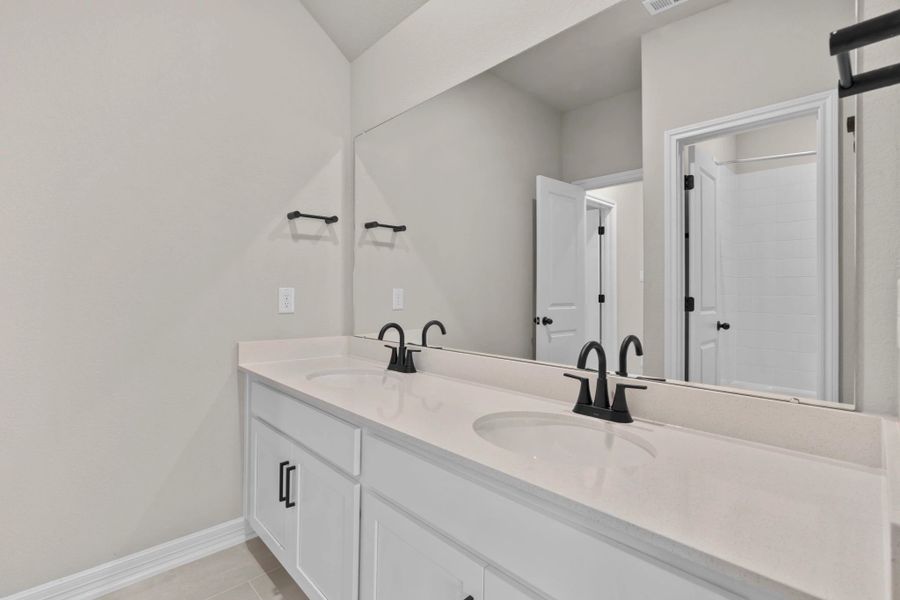 Secondary bathroom. Sample product photo. Actual exterior and interior selections may vary by homesite. Photo may be virtually staged.