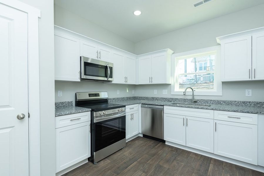 Furnished interior in a model home at Pinnix Loop in Burlington (Image 5).
