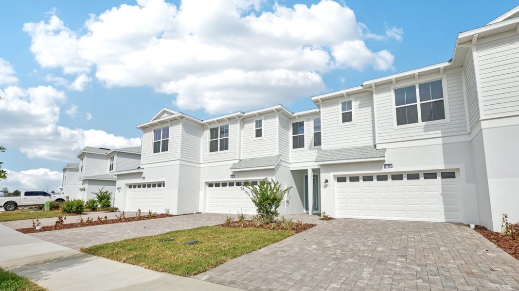 Front exterior of a new home in Isla Mirada, San Antonio, FL, highlighting curb appeal (Image 22).