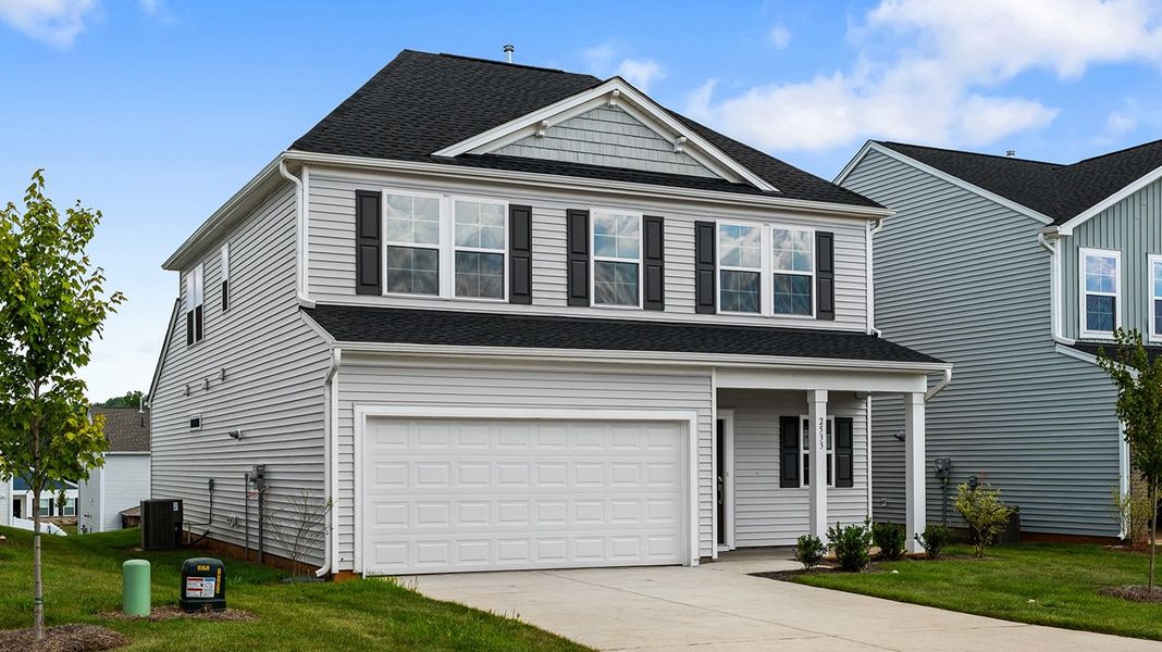 Front exterior of a new home in Hanes Lake, Winston-Salem, NC, highlighting curb appeal (Image 25). Front exterior of a new home in Hanes Lake, Winston-Salem, NC, highlighting curb appeal (Image 25).