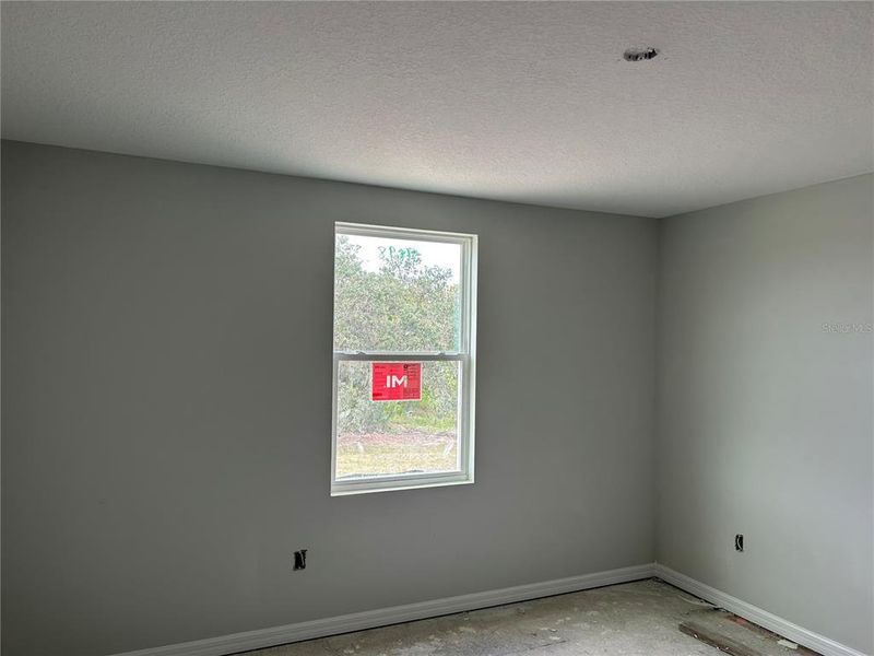 In-progress construction of a new home in Oakfield Trails Signature, Parrish, FL (Image 18).