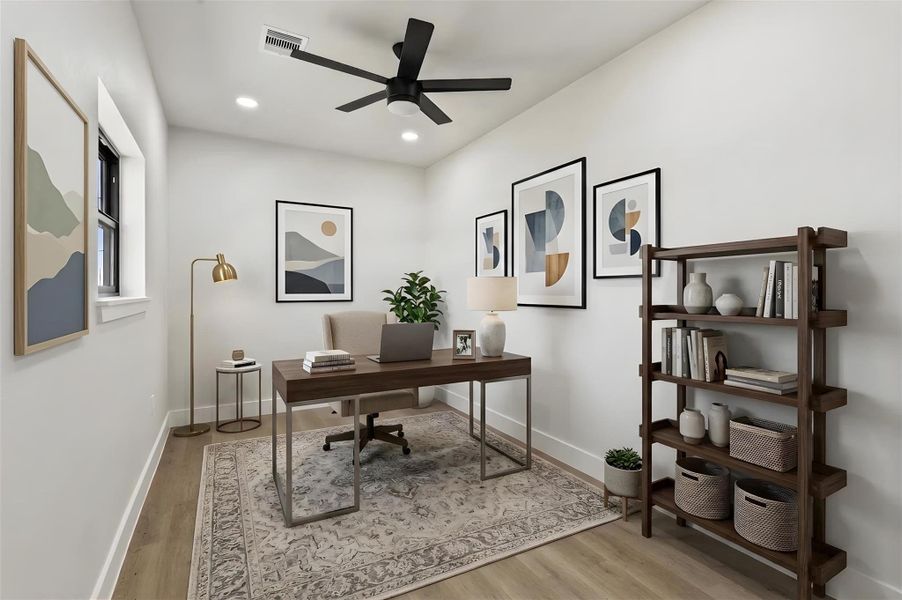 Dedicated home office conveniently located near the entryway and half bath, providing a quiet space for working from home, managing daily tasks, or pursuing hobbies. Virtually staged. Furniture and décor shown are for illustrative purposes only.