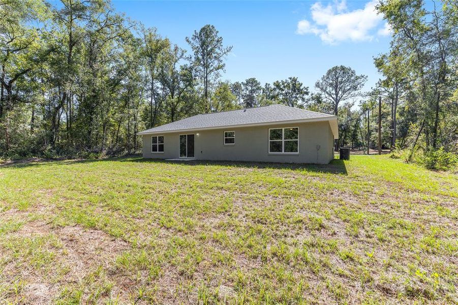 Exterior details and patio area of a home in , Citrus Springs (Image 17).