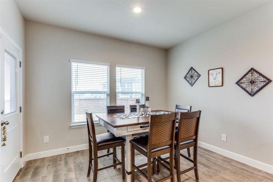 Dining room featuring a wealth of natural light and light hardwood / wood-style floors