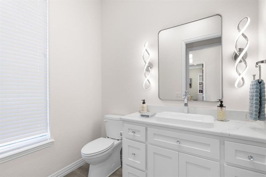 Bathroom with vanity and dark tile patterned flooring Bathroom with vanity and dark tile patterned flooring