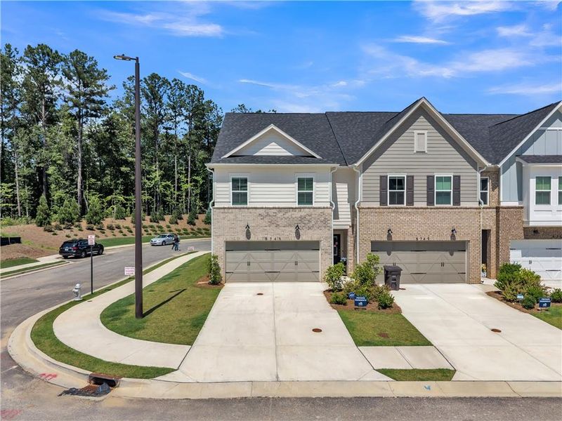 Front exterior of a new home in , Powder Springs, GA, highlighting curb appeal (Image 1). Front exterior of a new home in , Powder Springs, GA, highlighting curb appeal (Image 1).