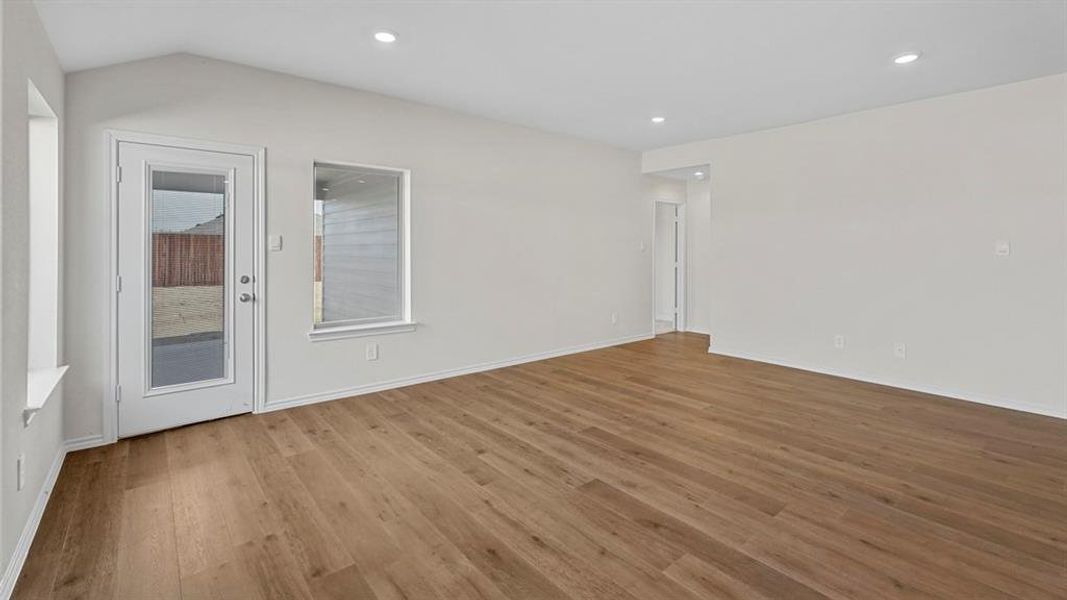 Spare room featuring wood finished floors and recessed lighting