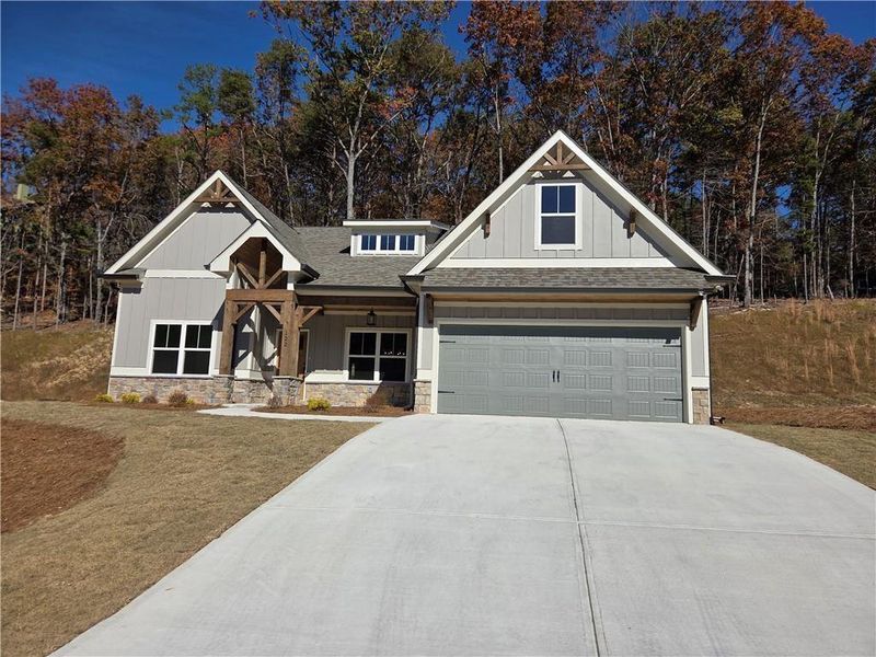 Front exterior of a new home in , Waleska, GA, highlighting curb appeal (Image 1).