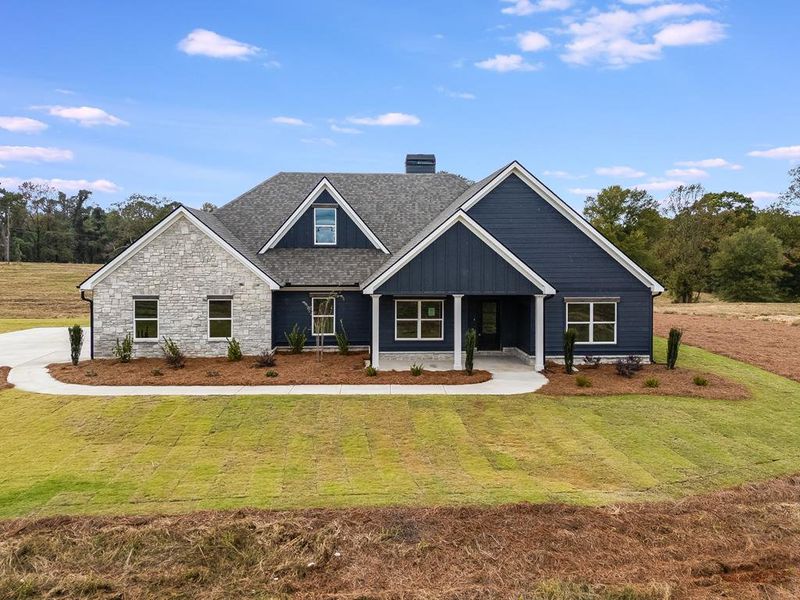 Front exterior of a new home in Parmer Farms, Roopville, GA, highlighting curb appeal (Image 1).