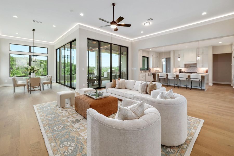 An open-concept living space with expansive glass doors framing scenic views, seamlessly connecting indoor and outdoor entertaining.