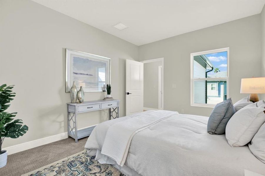 Furnished interior view inside a new home in The Towns At Long Bayou, Seminole (Image 7). Furnished interior view inside a new home in The Towns At Long Bayou, Seminole (Image 7).