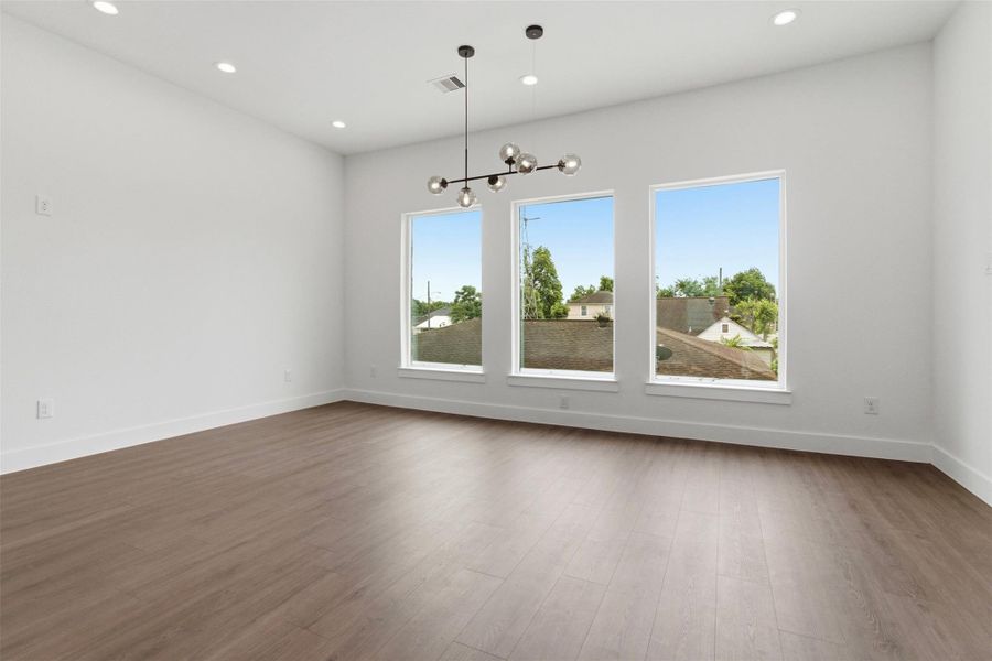 Bright dining/living space with large windows