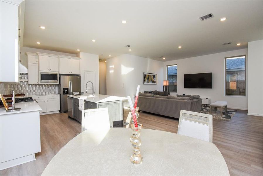 This is the comfortable view from kitchen breakfast/casual dining nook into the huge living/family space.