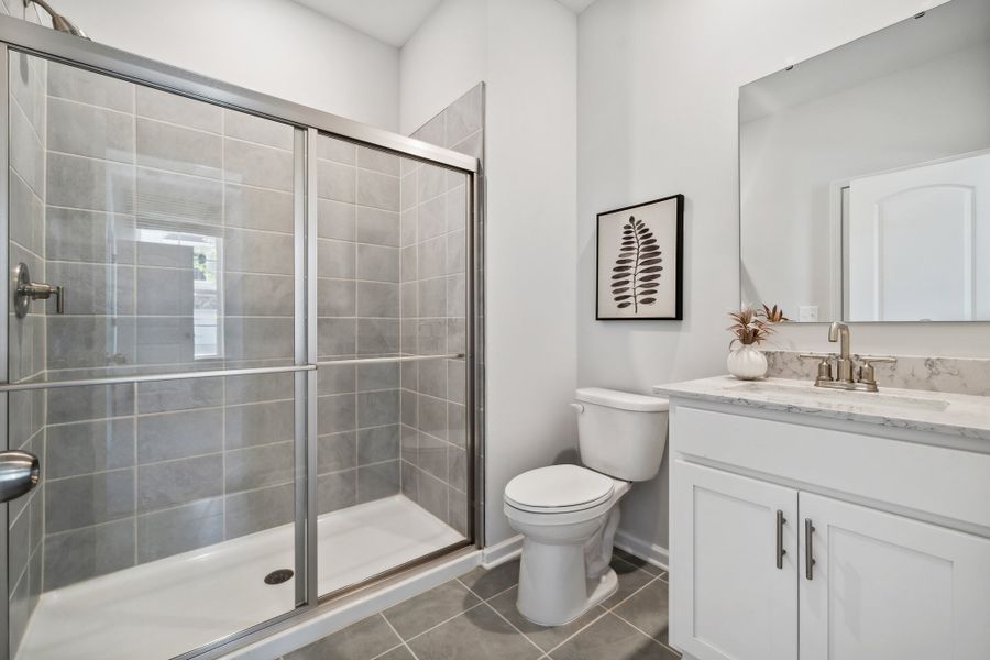 A bathroom with a glass shower.