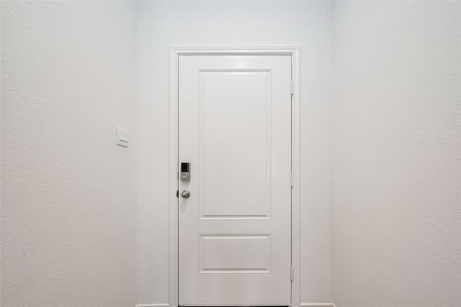 From inside the front door, the home opens with a warmly lit entry area. Ceiling lights provide consistent illumination, setting the tone for the rest of the home’s welcoming interior. From inside the front door, the home opens with a warmly lit entry area. Ceiling lights provide consistent illumination, setting the tone for the rest of the home’s welcoming interior.