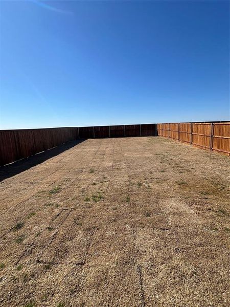 View of yard featuring a fenced backyard