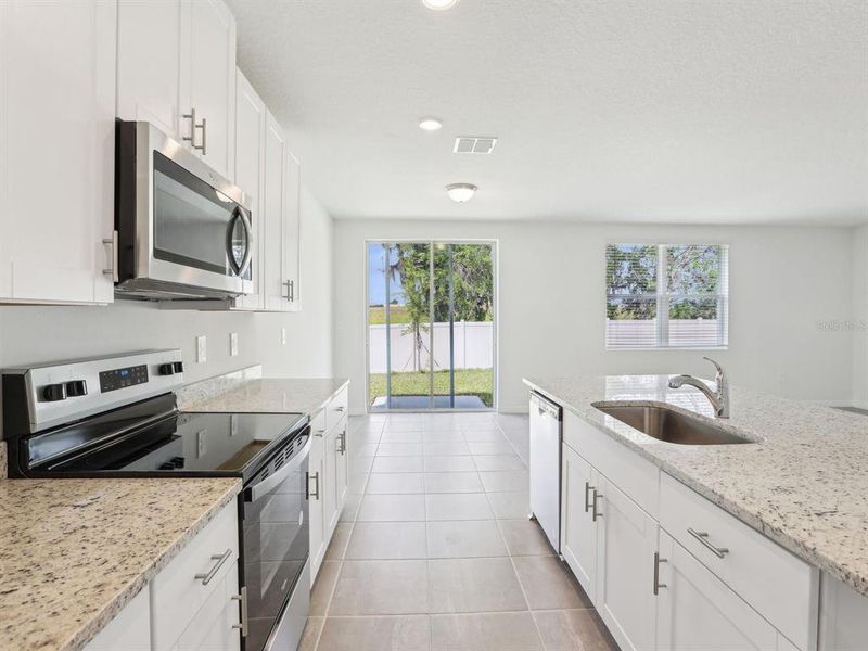 Furnished interior view inside a new home in The Reserve at Van Oaks, Auburndale (Image 8).